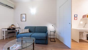 Apartment | Living area | 40-inch flat-screen TV with digital channels, streaming services