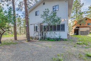 A two-story house with a gravel driveway and a small porch. - Ruidoso Retreat w/ Grill ~ 3 Mi to Grindstone Lake (Ruidoso)