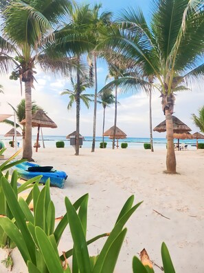 On the beach, sun-loungers, beach towels