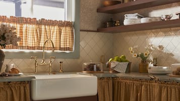 A kitchen with a window, a sink, and a countertop.