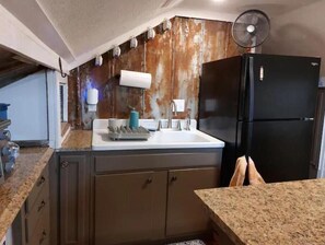 Fridge, microwave, stovetop, coffee/tea maker