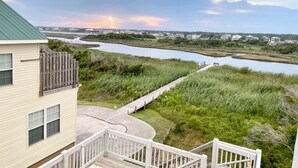 A house with a deck overlooking a river and marshland. - BEACH PLEASE! Amazing Ocean and Sound Views with Easy Beach Access! Pet Friendly (North Topsail Beach)