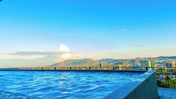 Outdoor pool, open 5:00 AM to 10:00 PM, sun loungers