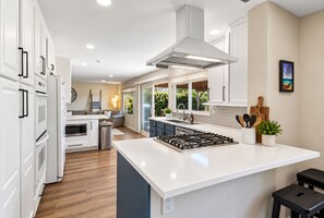 Prep at the sink while you soak in the hillside view - Spacious Family Retreat · Views · Hot Tub · BBQ · Sleeps 6-10 (San Diego)