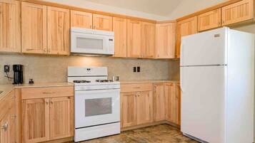 Fridge, coffee/tea maker, cookware/dishes/utensils