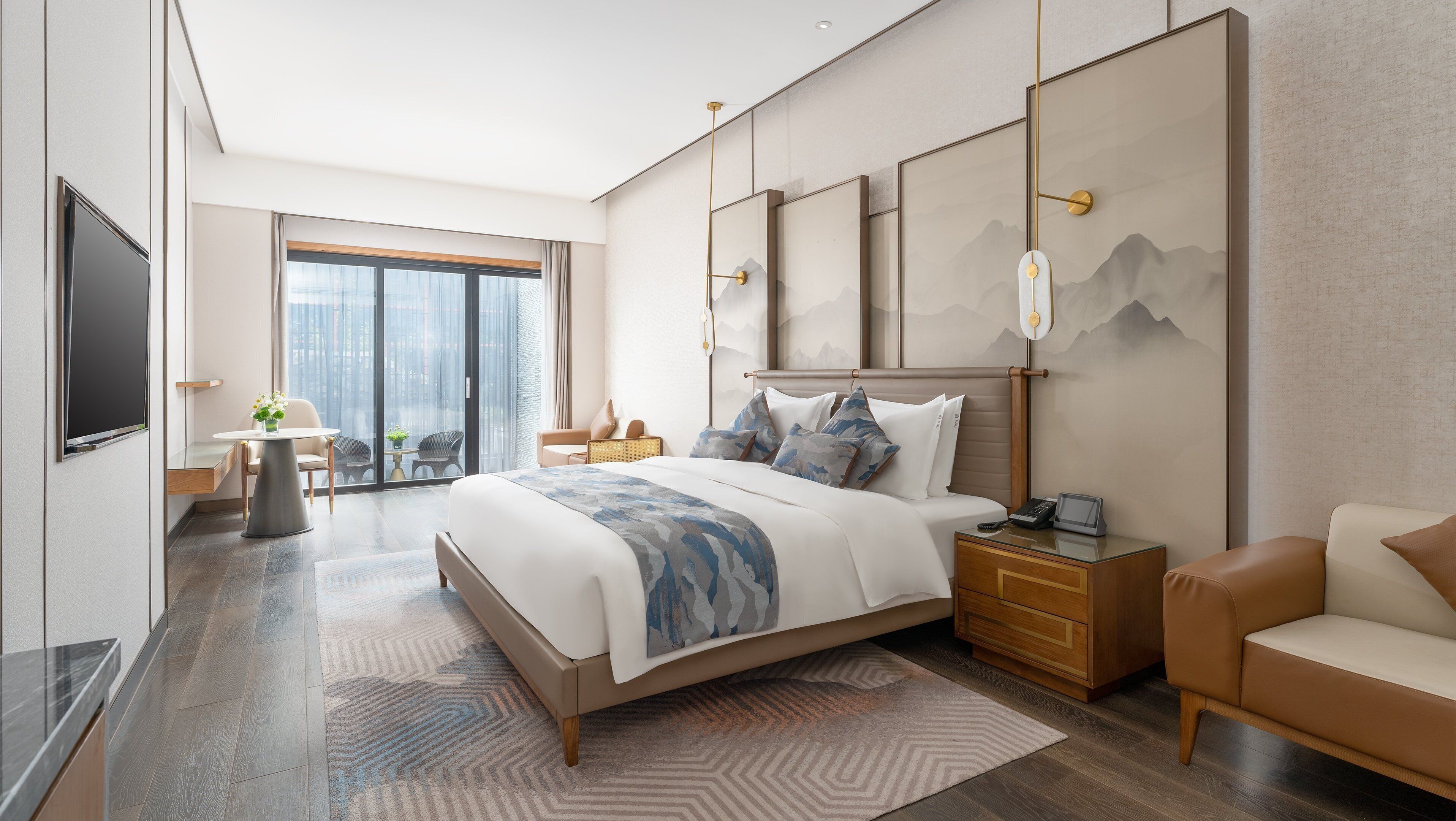 A modern hotel room with a large bed, a desk, a chair, a TV, and a view of the city.