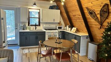 Fridge, microwave, cookware/dishes/utensils, dining tables