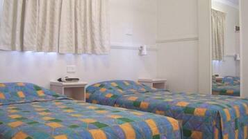 Deluxe Triple Room | Desk, laptop workspace, iron/ironing board, free WiFi