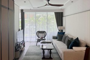 Appartement Exclusif | Coin séjour | Télévision à écran plat