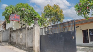 A gated property with a sign reading "Ari Grand House." - Asri Guesthouse (Aik Berik)