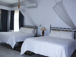 Family Room | Minibar, in-room safe, desk, laptop workspace - The Landmark Boutique Hotel (Blantyre)