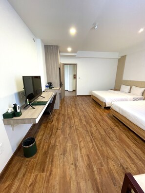 Superior Quadruple Room, 2 Queen Beds | Living area | TV - The Mansion Hotel Bien Hoa (Bien Hoa)