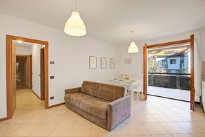 Family Apartment, Multiple Bedrooms, 2 Bathrooms (Magnolia - New Apartment Laveno) | Living area | 21-inch flat-screen TV with cable channels, TV - Magnolia - New Apartment Laveno Center (Laveno Mombello)