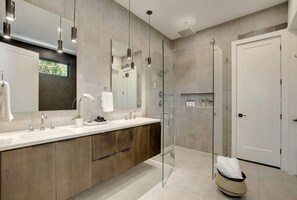 Shower, hair dryer, towels, shampoo