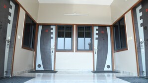 A hotel entrance with two doors, each marked with a number. - Hotel durga (Abu Road)