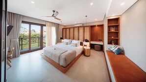 A modern bedroom with a large bed, a ceiling fan, a bedside table, a bench, and a view of the outdoors. - Kolila Villa Seminyak by Ini Vie Hospitality (Kerobokan)