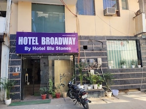 A building with a sign reading 'HOTEL BROADWAY By Hotel Blu Stones'. - Hotel Broadway at Airport (New Delhi)