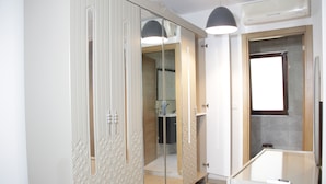 A modern bathroom with a glass shower enclosure, a white vanity, and a ceiling-mounted light fixture. - Solo Suites Hotel (Istanbul)