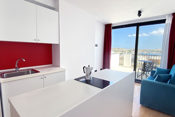 Executive Penthouse, Vision Accessible, Sea View | Living area | Smart TV