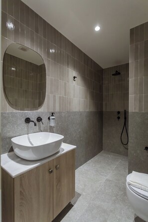 Shower, hair dryer, towels, toilet paper