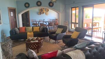 Deluxe Room, Beach View | Living area | 46-inch Smart TV with satellite channels, printers