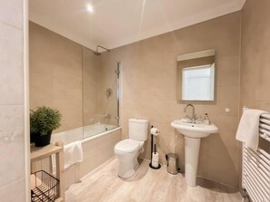 Shower, hair dryer, towels, shampoo