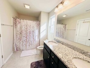 Shower, hair dryer, towels, shampoo