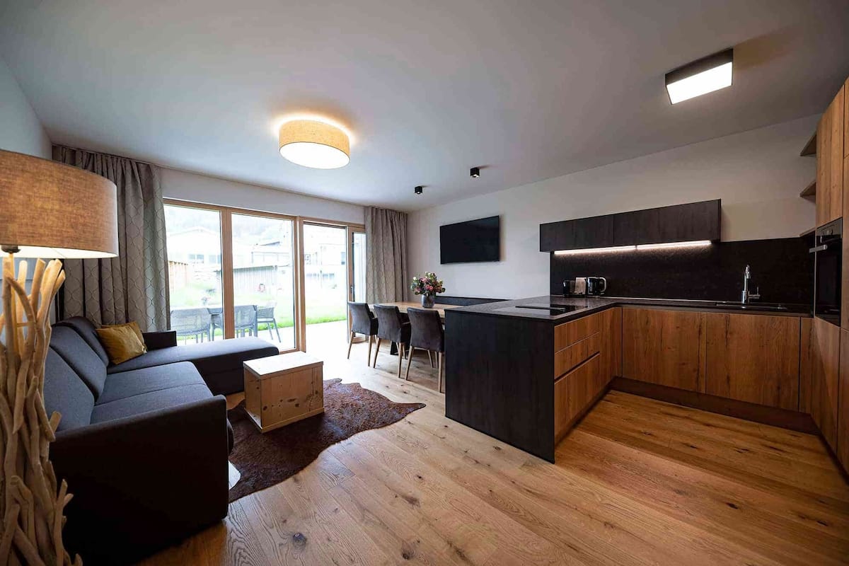 Luxury Apartment | Living area | 55-inch Smart TV with cable channels