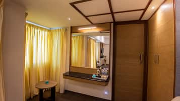 Economy Suite, 1 Bedroom, Private Bathroom | Living area | 44-inch Smart TV with satellite channels