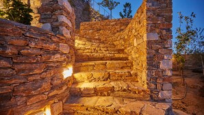 A stone staircase leading up to a higher level, surrounded by stone walls and vegetation. - Sunrise Garden Hills (Zagora-Mouresi)