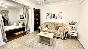 Classic Apartment | Living area | 116-cm LCD TV with cable channels