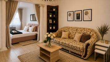 Classic Apartment | Living area | 116-cm LCD TV with cable channels