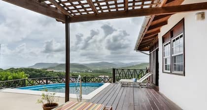 Charming Cottage Located In Cap Estate - Orchid Cottage 1 Bedroom Home by RedAwning