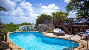 A swimming pool with a stone border, a hot tub, and lounge chairs. - Hilltop Villa With Great Views Out To Sea - Villa Cadasse 3 Bedroom Villa by RedAwning (Gros Islet)