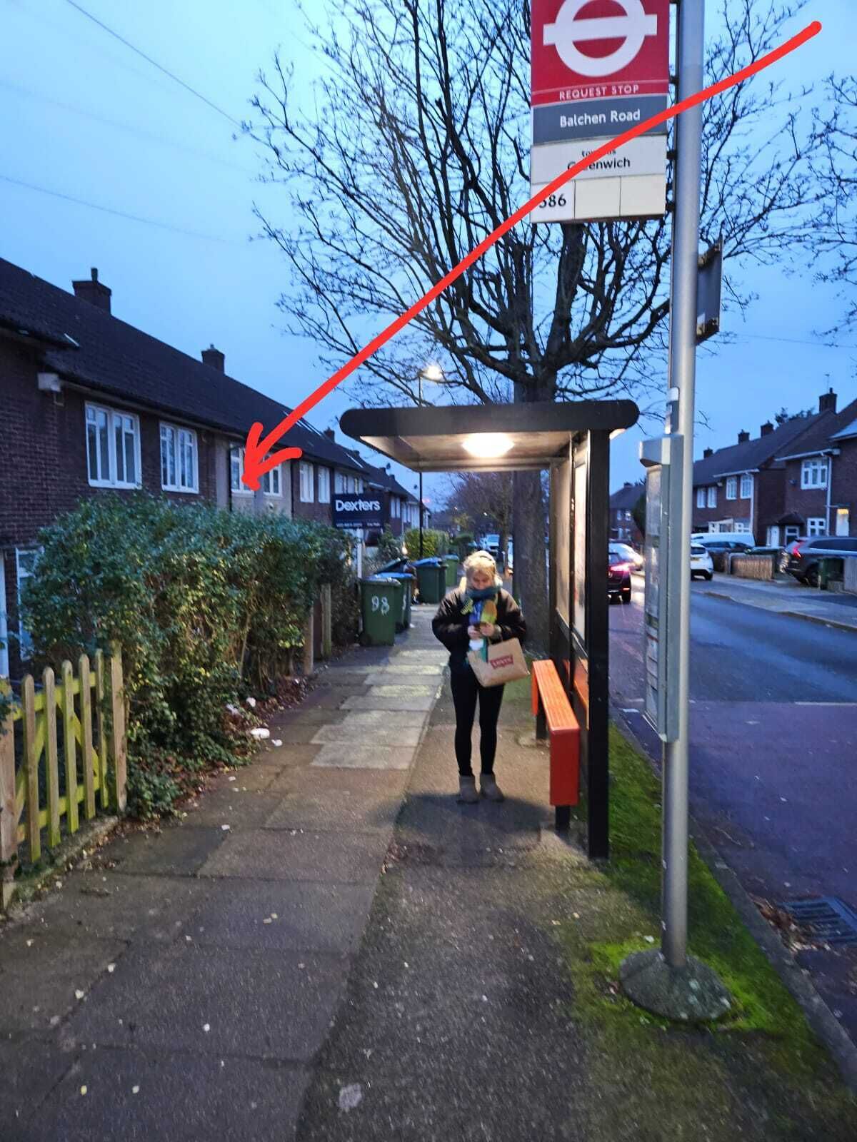 A bus stop shelter with a sign for the request stop at Bathen Road.