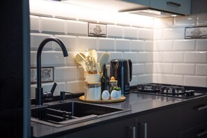 Fridge, microwave, oven, stovetop - GG Home - cozy 2-bedroom apartment in Vake at Mziuri park (T'bilisi)