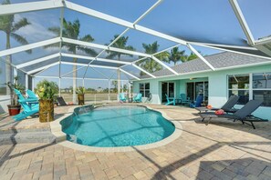 House (4 Bedrooms) | Interior - Pool w/ Waterfall: Colorful Cape Coral Gem! (Cape Coral)