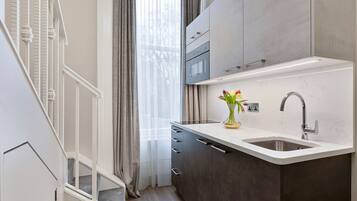 Mezzanine Studio Suite | Iron/ironing board, free cots/infant beds, free WiFi, bed sheets