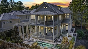 A two-story house with a large balcony, a swimming pool, and a well-maintained garden. - Close to Parks with Private Pool and Bikes (Santa Rosa Beach)