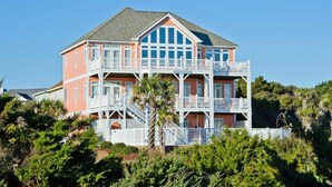 A multi-story beachfront house with balconies, a staircase, and a view of the ocean. - Bermuda House, Almost Oceanfront House in Emerald Isle, NC! (Emerald Isle)