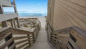 A wooden staircase leading to a beach with a clear view of the ocean. - Enclave 702A | 7th Floor Penthouse • Across from Gated Beach • Pool-View Balcony (Destin)