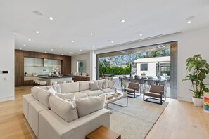 Luxury House, Multiple Beds, Pool Access, Pool View (Melvin Modern) | Living area | 65-inch flat-screen TV with digital channels - Melvin - Modern Contemporary Estate w/ Backyard + Pool & Spa (Tarzana)