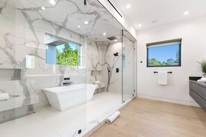 Luxury House, Multiple Beds, Pool Access, Pool View (Melvin Modern) | Bathroom | Deep-soaking bathtub, towels - Melvin - Modern Contemporary Estate w/ Backyard + Pool & Spa (Tarzana)