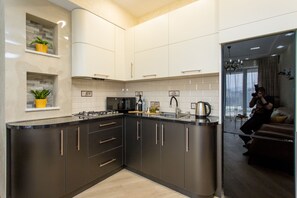 Fridge, microwave, stovetop, coffee/tea maker - GG Home - 2-bedroom apartment with wonderful view to city at Mziuri Park (T'bilisi)