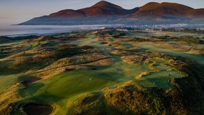 A golf course with rolling hills and a distant mountain range. - Cosy Barn Conversion in the Mournes (Newry)