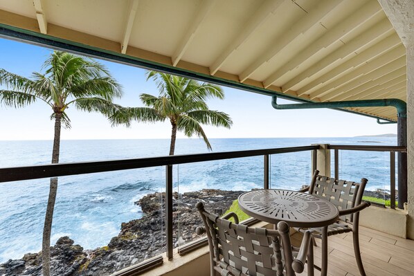 Outdoor dining - Updated waterfront condo with ocean views, heated pool, & private lanai (Koloa)