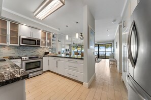 Fridge, microwave, oven, stovetop - Updated waterfront condo with ocean views, heated pool, & private lanai (Koloa)