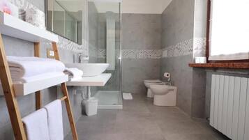 Shower, rainfall showerhead, hair dryer, towels