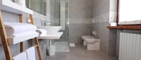Shower, rainfall showerhead, hair dryer, towels