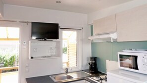 Fridge, microwave, espresso maker, cookware/dishes/utensils